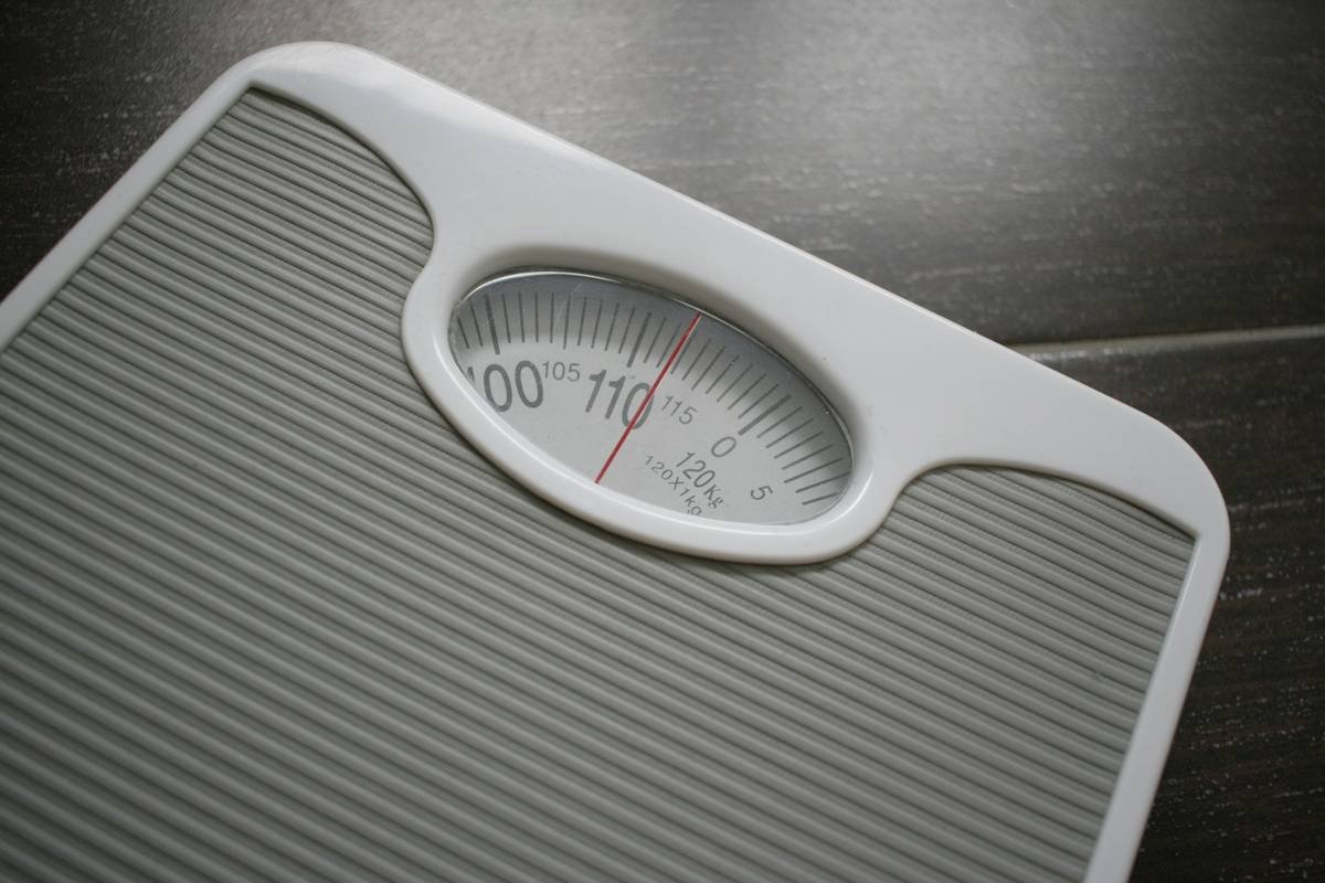 Side-by-side comparison showing body fat percentage tool readings vs. tape measure and progress photos